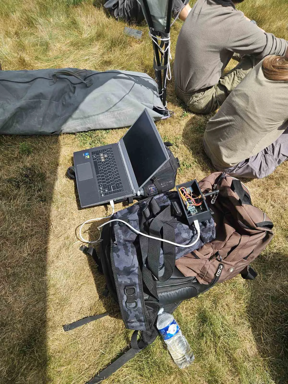 Preparing the SARISSA scientific experiment with a computer and electronics at the launch site