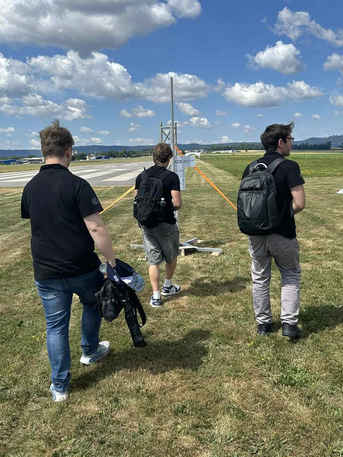 HEPHAESTUS members carry their equipment to the SARISSA launch site